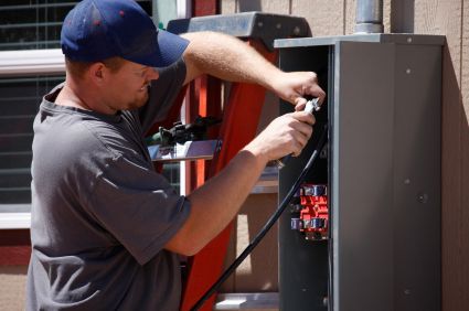 Electrician upgrading an electrical service panel